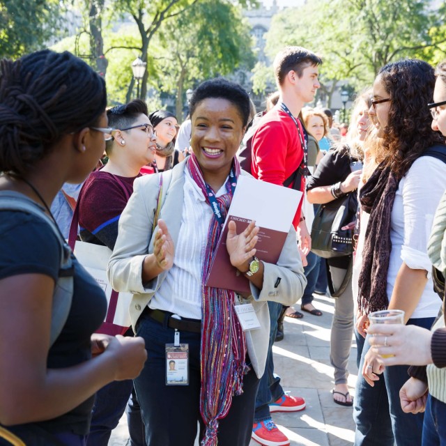 A group of graduate students outside on campus