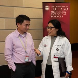 Xiaoyang Wu, PhD, talks with Nan Chen, MD